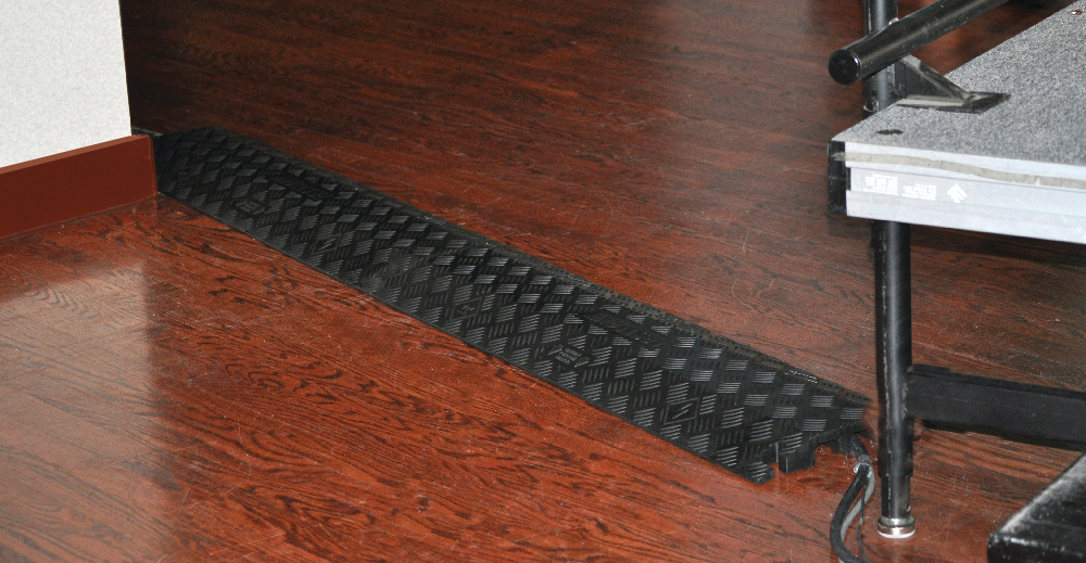 Light-duty cable covers guard protect cords in an office